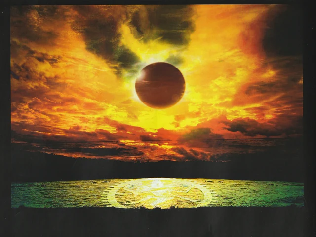 A dark disc above a glowing golden circle beneath a fiery sky.