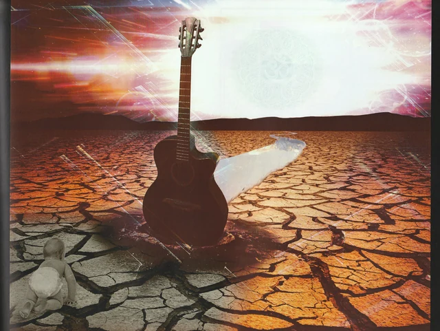 A guitar standing on cracked earth beneath a luminous sky.