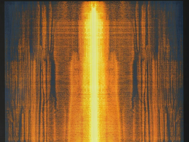 A bright vertical band of gold against fine orange and black streaks.
